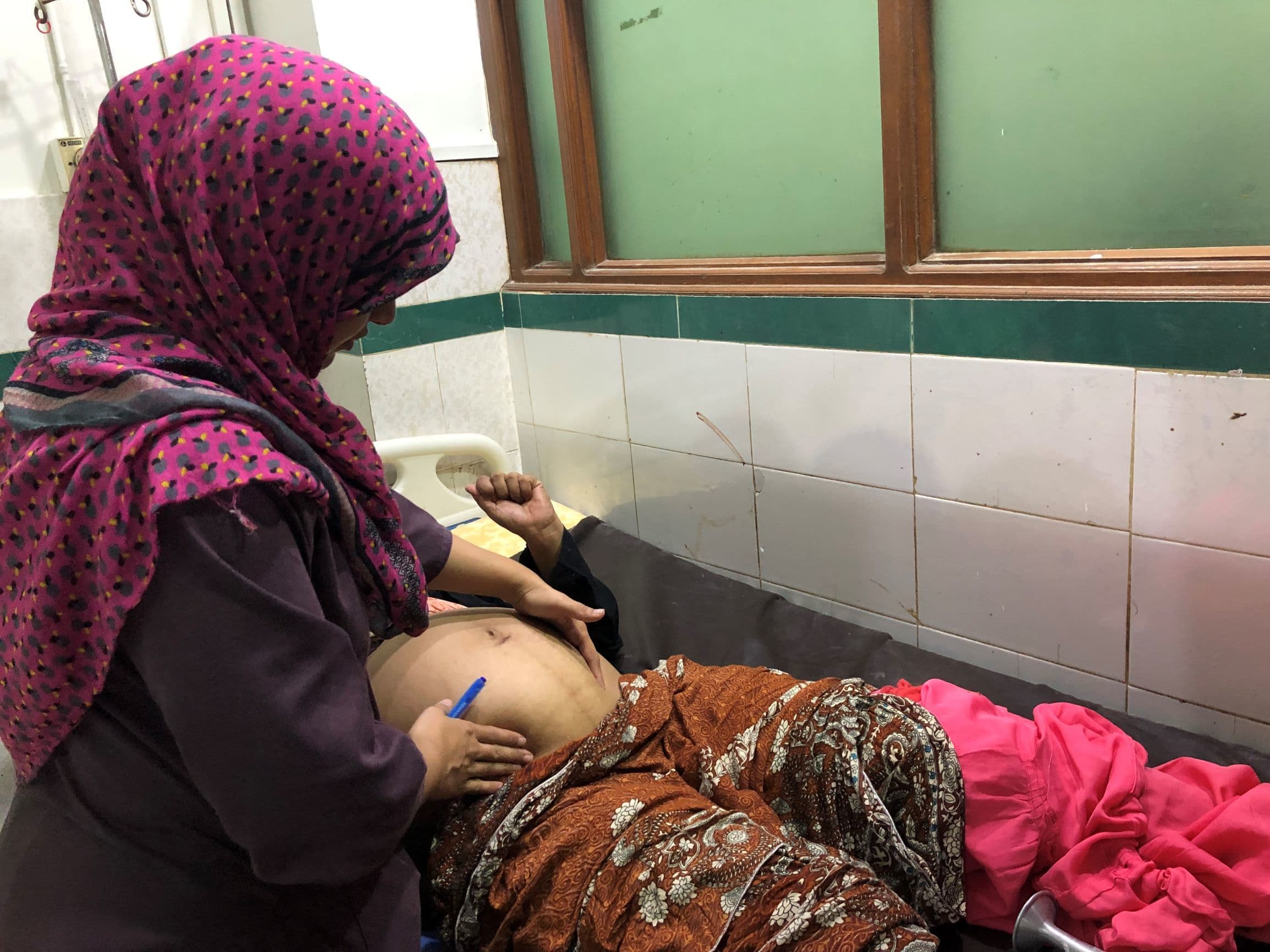 Doctors have a very short window from the time a woman comes to a healthcare facility to have her baby to introduce and administer IUDs to her because once she leaves, they've lost her until her next pregnancy.  &mdash; *Photo by author*