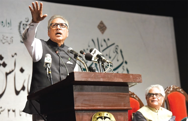 President Dr Arif Alvi speaks at the calligraphy exhibition on Tuesday. — Photos by Tanveer Shahzad