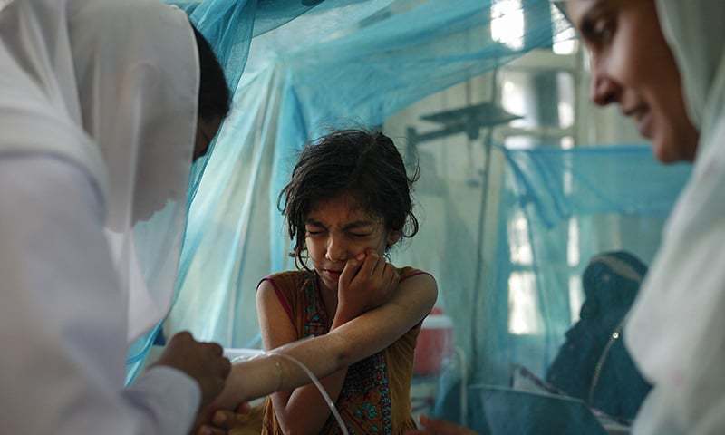 A child is examined at the dengue ward at the Benazir Bhutto Hospital, Rawalpinidi – Photo: Sara Farid