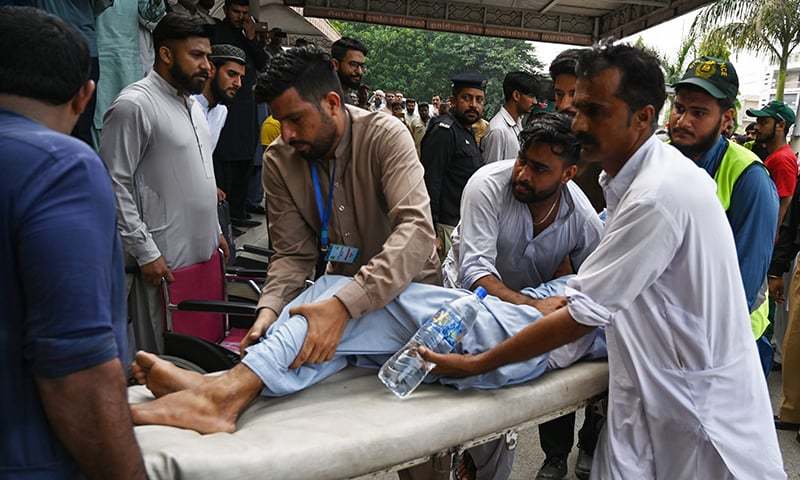 Paramedics shift an injured following a quake of 4.4 magnitude, in Mirpur in AJK on September 26, 2019. — AFP