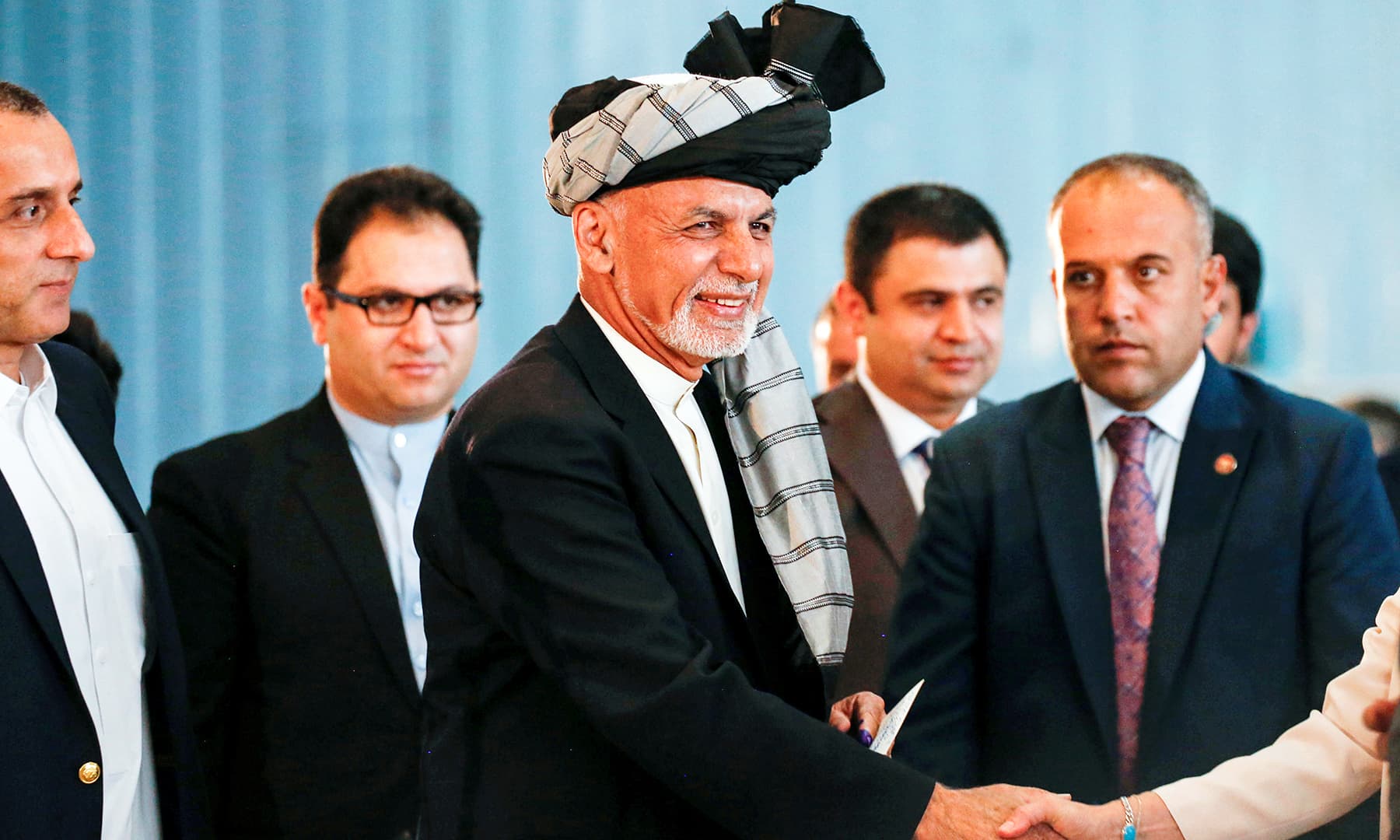 Afghan presidential candidate Ashraf Ghani arrives to cast his vote in the presidential election in Kabul. — Reuters