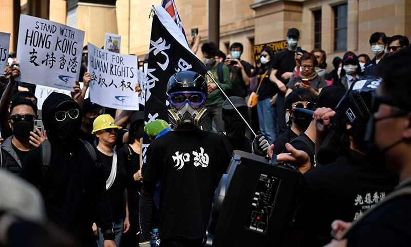 Supporters of the Hong Kong pro-democracy protesters gather ahead of a march as part of the global "anti-totalitarianism" movement in Sydney on September 29. — AFP Supporters of the Hong Kong pro-democracy protesters gather ahead of a march as part of the global "anti-totalitarianism" movement in Sydney on September 29. — AFP