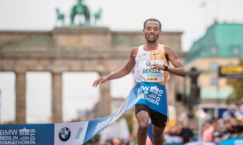 KENENISA Bekele crosses the finish line to win the Berlin Marathon on Sunday.&mdash;AFP