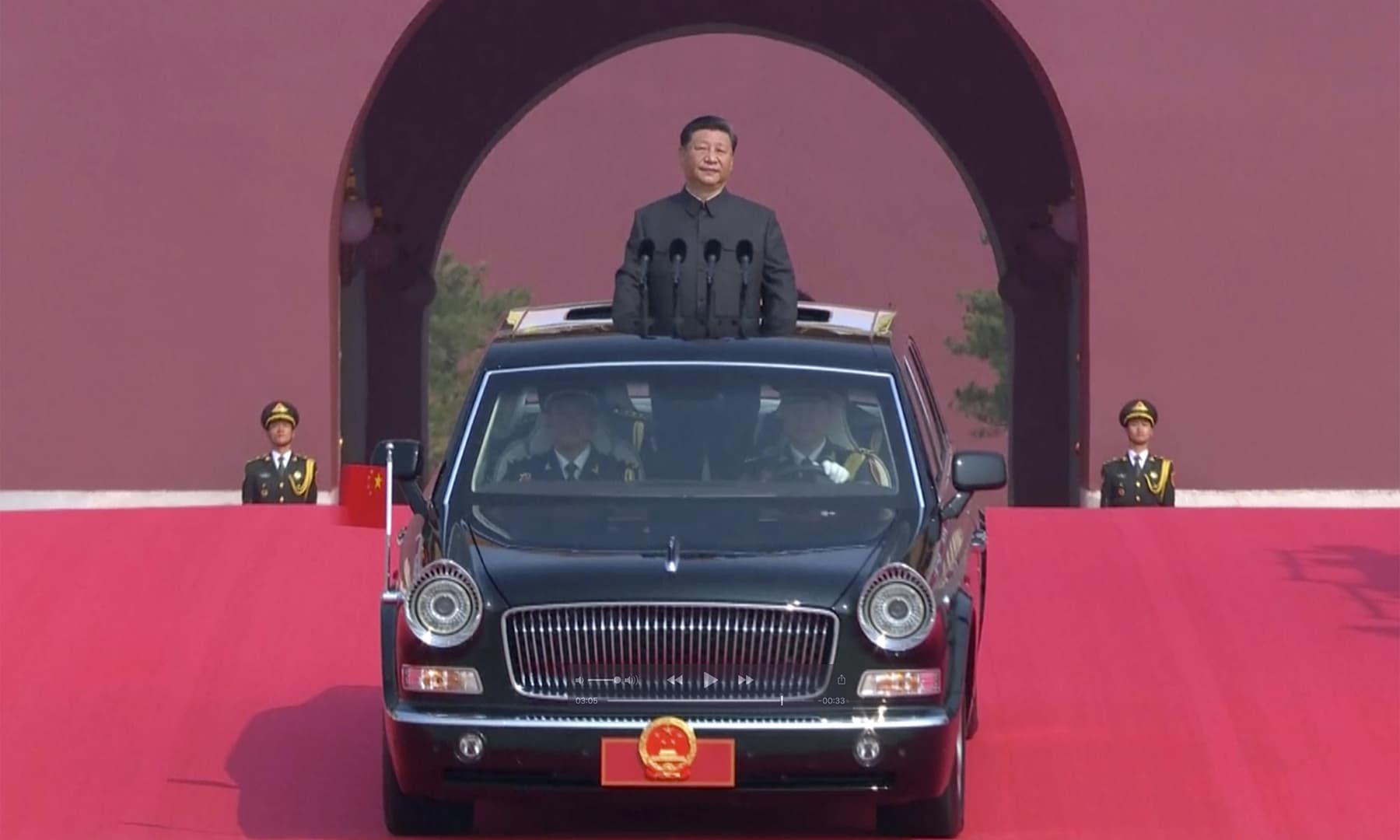 In this image made from video, Chinese leader Xi Jinping rides an open-top limousine during a parade to mark the 70th anniversary of the founding of Communist China, in Beijing. — AP