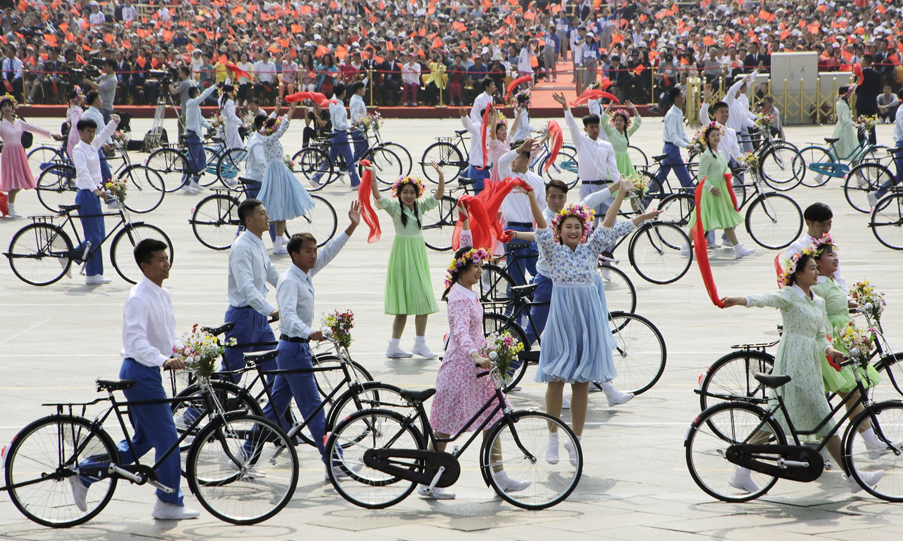 Performers with bicycles take part in the parade marking the 70th founding anniversary of People's Republic of China, on its National Day in Beijing. — Reuters