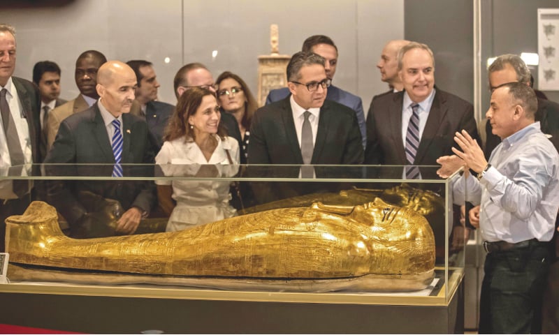 Cairo: Egypt’s Antiquities Minister Khaled El-Enany (third right) and Chargé d’Affaires at the US Embassy in Cairo Thomas Goldberger (second right) look at the Golden Coffin of Nedjemankh, on display at the National Museum of Egyptian Civilisation following its repatriation from the US. — AFP