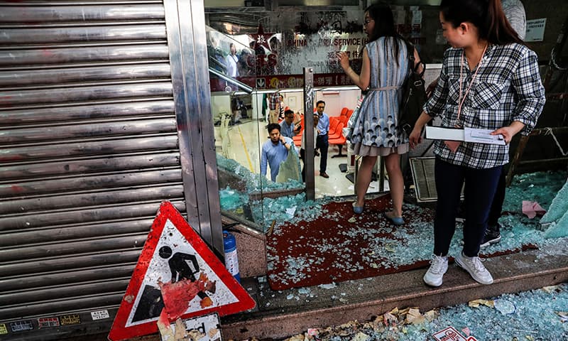 Employees of China Travel Service, a tourism and travel agency of the China government, are seen at their vandalised office in Tsuen Wan, Hong Kong, China on October 2, 2019. — Reuters