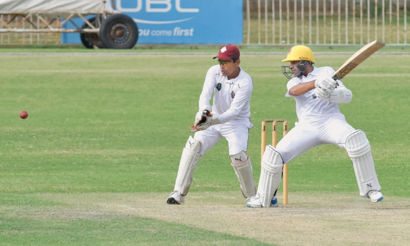 KARACHI: Sindh opener Abid Ali cuts as Southern Punjab wicket-keeper Adnan Akmal looks on during the Quaid-e-Azam Trophy match at the UBL Sports Complex on Sunday.—Tahir Jamal / White Star KARACHI: Sindh opener Abid Ali cuts as Southern Punjab wicket-keeper Adnan Akmal looks on during the Quaid-e-Azam Trophy match at the UBL Sports Complex on Sunday.—Tahir Jamal / White Star