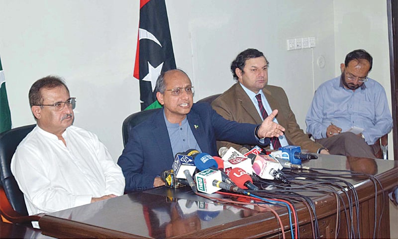 SINDH minister Saeed Ghani makes a gesture during a charged press conference as Aijaz Hussain Jakhrani and others look on. — PPI