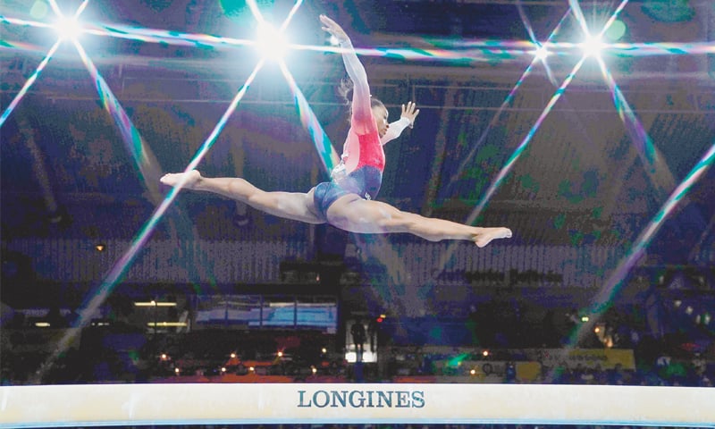 SIMONE Biles of the US performs on the beam during the during the FIG Artistic Gymnastics World Championships women’s team final at the Hanns-Martin-Schleyer-Halle.—AFP SIMONE Biles of the US performs on the beam during the during the FIG Artistic Gymnastics World Championships women’s team final at the Hanns-Martin-Schleyer-Halle.—AFP