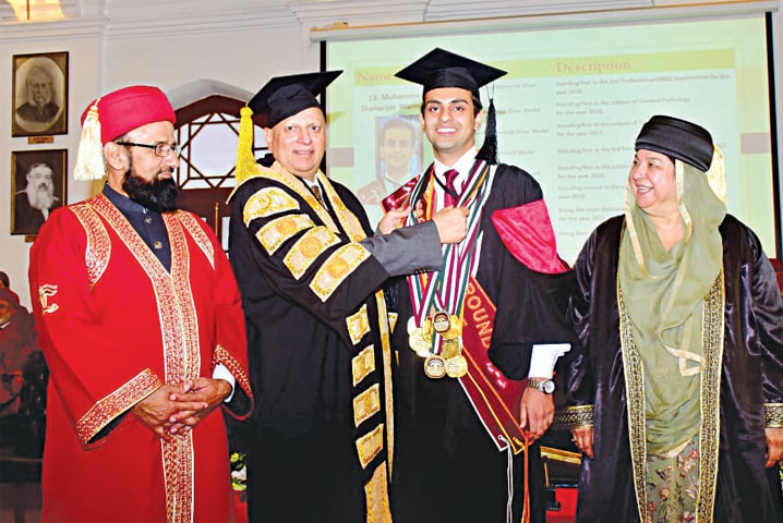 Governor Chaudhry Sarwar gives away a medal to a position holder at the King Edward Medical University convocation. — White Star