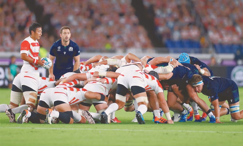 YOKOHAMA: Japan’s Yutaka Nagare (L) prepares to release the ball into a scrum next to Scotland’s Greig Laidlaw (second L) during their Rugby World Cup match at the International Stadium Yokohama on Sunday. — AFP