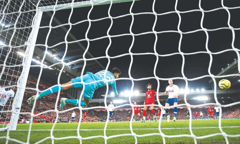 LIVERPOOL: Liverpool&rsquo;s Jordan Henderson (not in picture) scores during the Premier League match against Tottenham Hotspur at Anfield.&mdash;Reuters