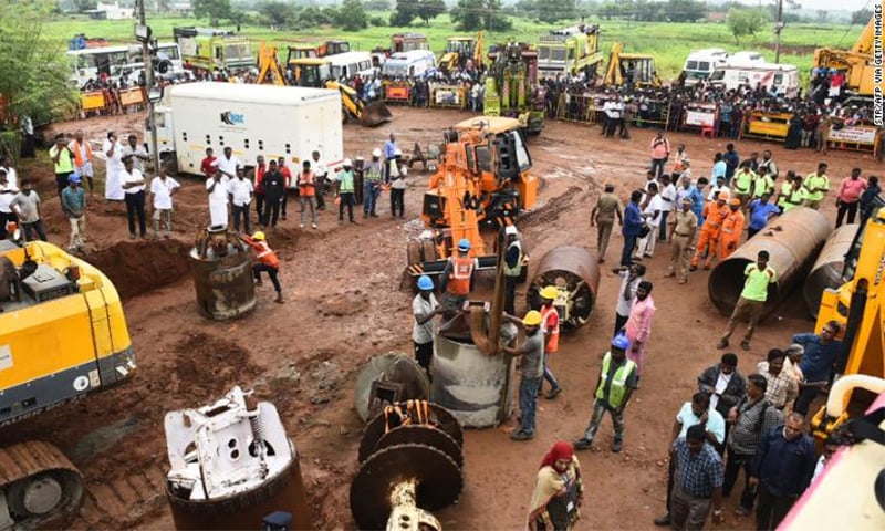 Rescue workers gather with heavy digging equipment during an operation to save a toddler trapped in a deep well in India's Tamil Nadu state. &mdash; Photo courtesy CNN