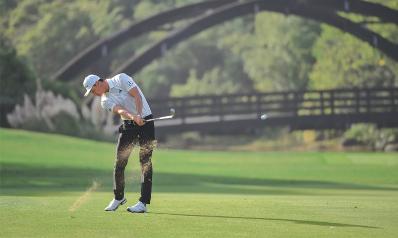 SHANGHAI: China&rsquo;s Li Haotong plays a shot during the WGC-HSBC Champions on Thursday.&mdash;AFP