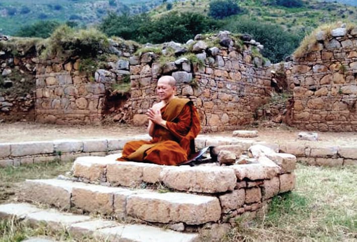 Chief Buddhist monk of the Sangha Supreme Council of Thailand Most Venerable Arayawangso performs rituals at Bhamla Stupa on  Friday. — Dawn