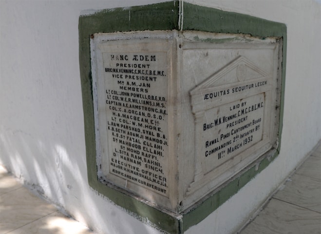 Plaques inscribed with the names of the English station commander of Rawalpindi and then elected members from the Muslim, Hindu and Sikh community.