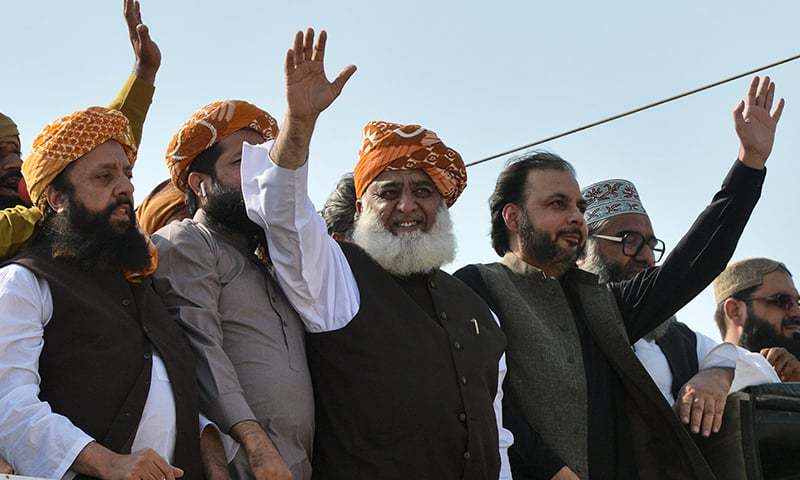 JUI-F chief Maulana Fazlur Rehman waves to supporters on his arrival to lead the 'Azadi March'. — AFP/File