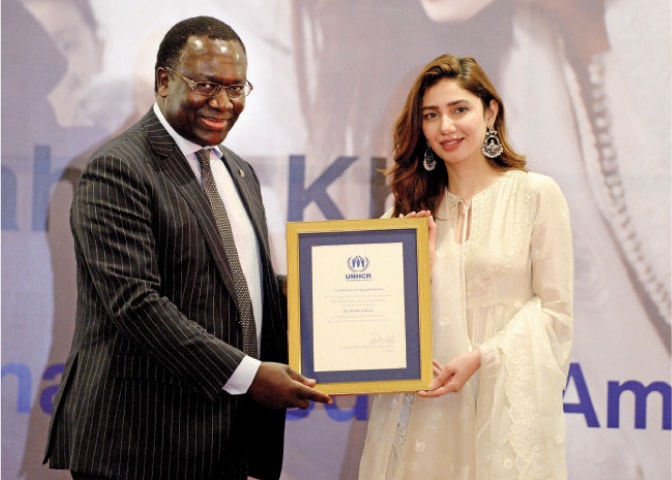 UNHCR’s Assistant High Commissioner for Operations George Okoth-Obbo and actress Mahira Khan pose with the certificate of appointment during a ceremony on Wednesday. — White Star