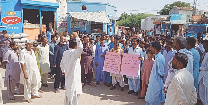 Nagarparkar residents hold a protest demonstration on Friday against unbridled extraction of granite from their area by unauthorised traders.—Dawn