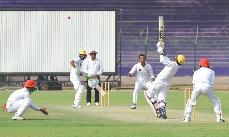 KARACHI: Sindh skipper Sarfraz Ahmed attempts to hit his Northern counterpart Nauman Ali over the top as non-striker Fawad Alam looks on during the Quaid-e-Azam Trophy match at the National Stadium on Tuesday.—Tahir Jamal / White Star KARACHI: Sindh skipper Sarfraz Ahmed attempts to hit his Northern counterpart Nauman Ali over the top as non-striker Fawad Alam looks on during the Quaid-e-Azam Trophy match at the National Stadium on Tuesday.—Tahir Jamal / White Star