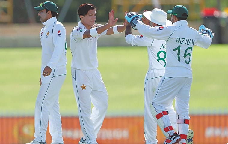 PAKISTAN paceman Mohammad Musa Khan (second L) celebrates with team-mates after taking a wicket during the tour match against Cricket Australia XI at the WACA Ground on Saturday.—Courtesy AAP