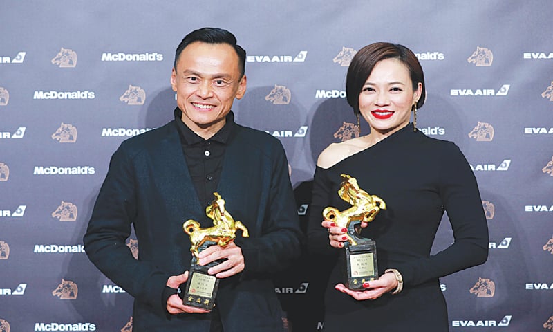 Taipei: Taiwanese actor CHEN Yi-wen and actress YEO Yann-yann pose with their trophy at the 56th Golden Horse film awards, dubbed the Chinese &lsquo;Oscars&rsquo;, on Saturday.&mdash;AFP