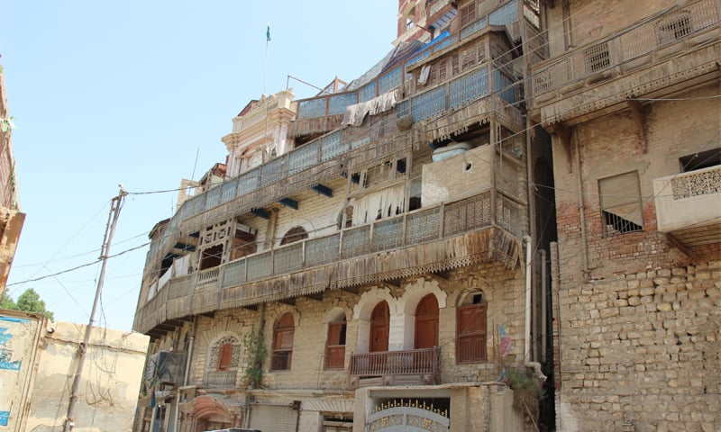 The overhung balconies supported by wood cornices -Photos by the writer