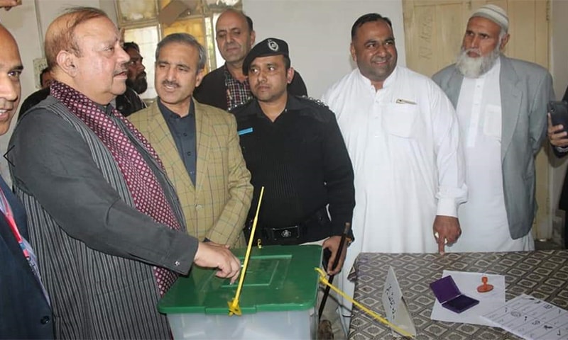 PTI's Barrister Sultan Mahmood casting his vote in Sunday's by-polls in Mirpur, Azad Jammu and Kashmir. &mdash; Photo by author