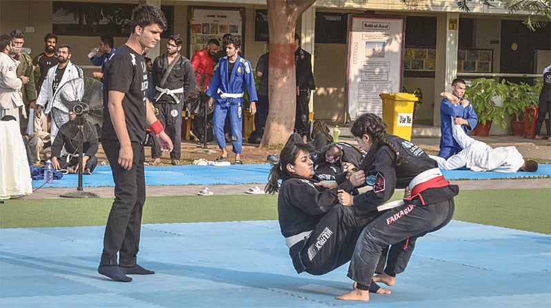 Two contestants hold each other in an &lsquo;arm bar&rsquo; during a competition on Saturday.&mdash;Fahim Siddiqi / White Star