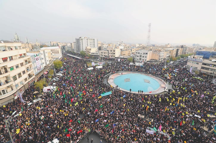 TEHRAN: Pro-government demonstrators gather in Enghelab Square on Monday to condemn days of &lsquo;rioting&rsquo; that the Iranian government blamed on its foreign foes.&mdash;AFP