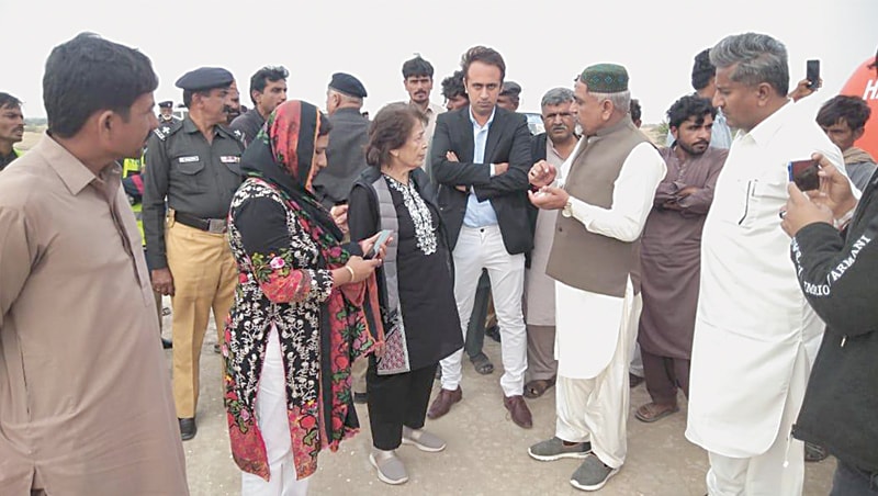 RETIRED Justice Majida Rizvi hears people’s complaints about unlawful granite extraction from Karoonjhar hills in Nagarparkar on Tuesday.—Dawn