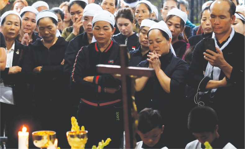 Tiep, one of the Vietnamese found dead aboard a lorry in Britain, attend the funeral.—Reuters