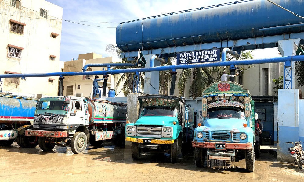 Tankers being filled up at the now regularised NIPA hydrant in Karachi. — Photo by Zofeen T. Ebrahim