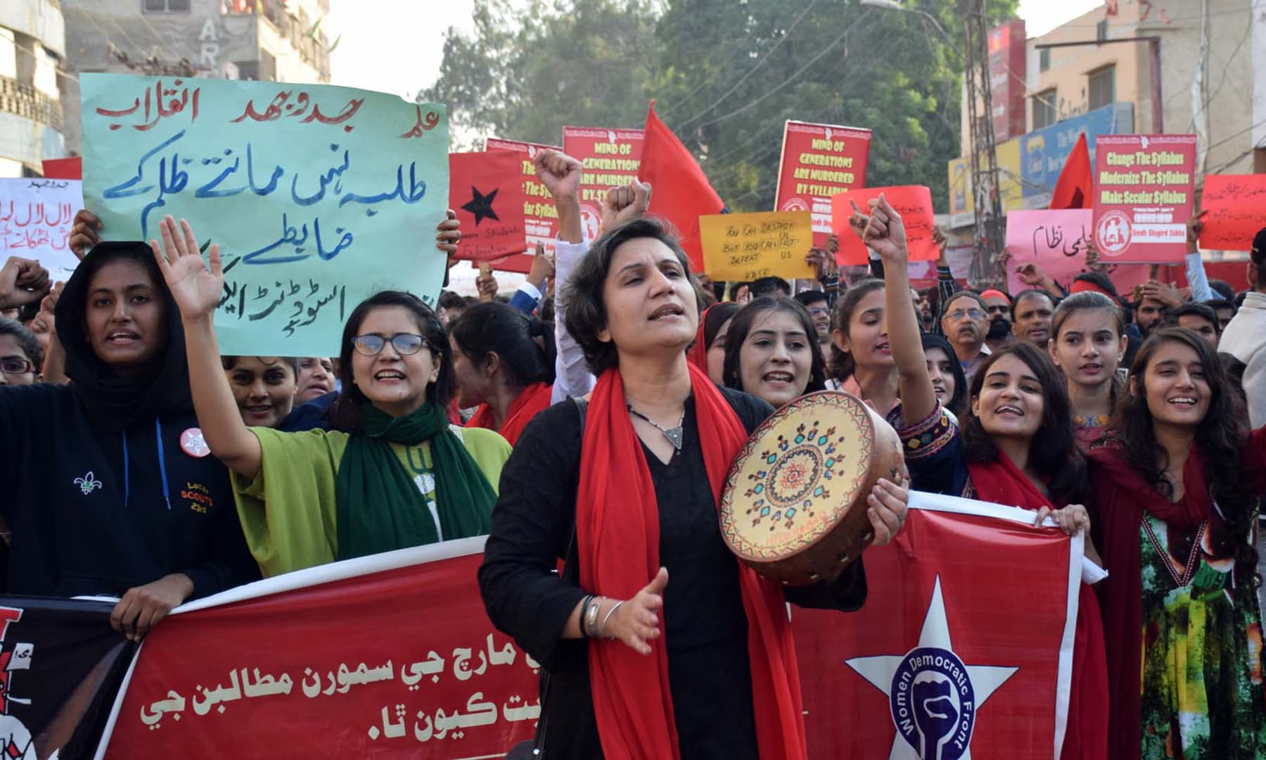 Protesters chanting slogans to the beat of a drum. —Photo by Umair Ali