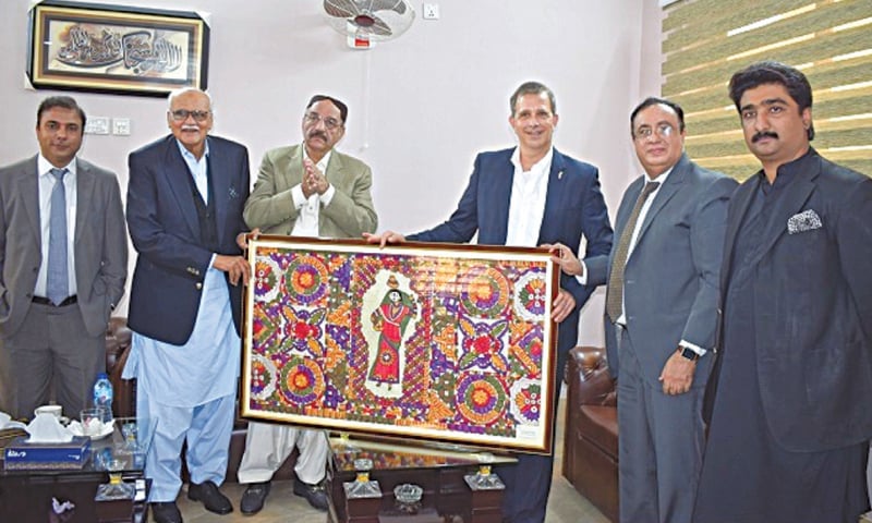 US Consul General Rob Silberstein receives a gift from MNA Mir Munawwar Ali Khan Talpur during his visit to Mirpurkhas on Tuesday. US Consul General Rob Silberstein receives a gift from MNA Mir Munawwar Ali Khan Talpur during his visit to Mirpurkhas on Tuesday.