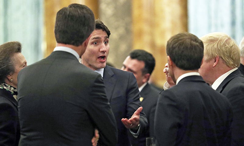 Canadian Prime Minister Justin Trudeau standing in a huddle with French President Emmanuel Macron, British Prime Minister Boris Johnson, Dutch Prime Minister Mark Rutte and Britain's Princess Anne, daughter of Queen Elizabeth II at a Buckingham Palace reception for NATO leaders on Tuesday evening. — AP