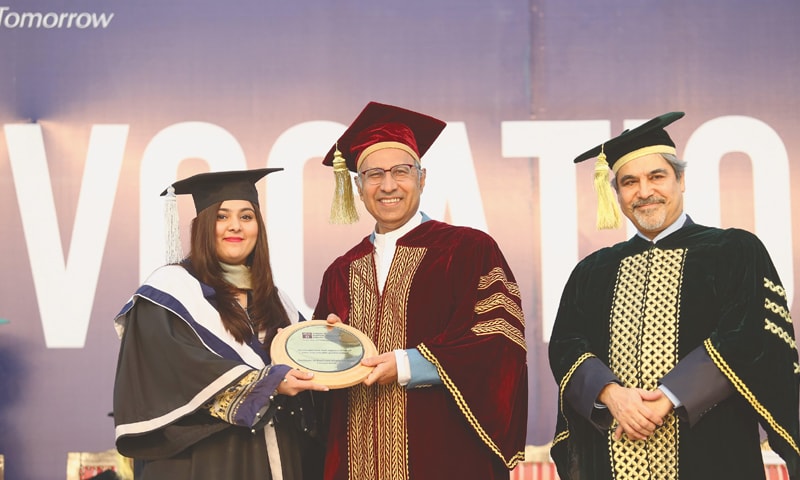 Dr Abdul Hafeez Shaikh and IBA Karachi Executive Director Dr Farrukh Iqbal with a student at the convocation.