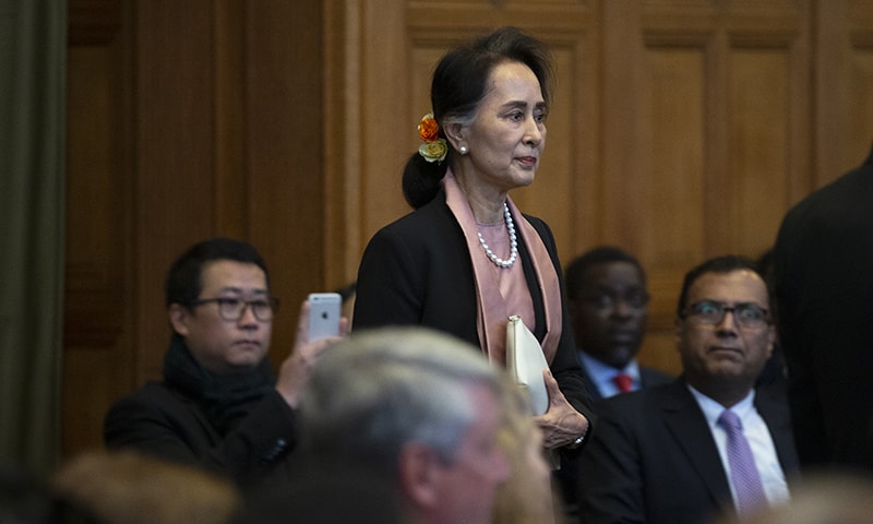 Myanmar's leader Aung San Suu Kyi enters the court room of the International Court of Justice for the first day of three days of hearings in The Hague, Netherlands on Tuesday, December 10, 2019. — AP