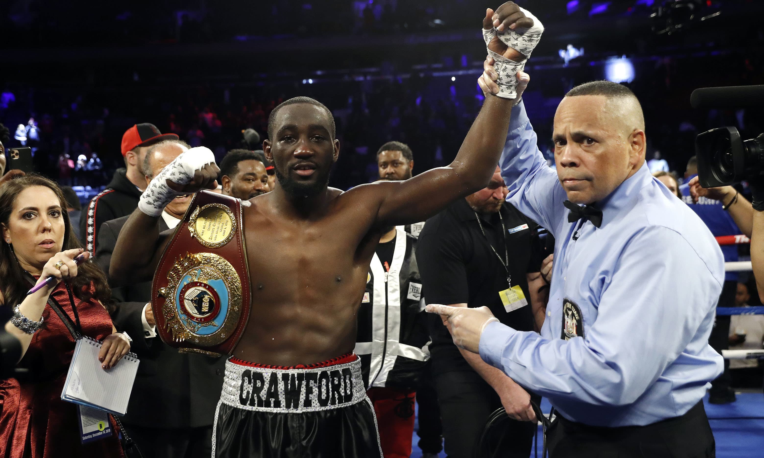 Terence Crawford has his hand raised in victory after defeating Lithuania's Egidijus Kavaliauskas by TKO in the ninth round of a WBO welterweight boxing match on Dec 14. &mdash; AP