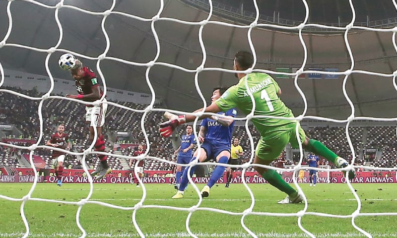 DOHA: Flamengo’s Bruno Henrique (L) heads to score during the Club World Cup semi-final against Al Hilal at the Khalifa International Stadium.—AP DOHA: Flamengo’s Bruno Henrique (L) heads to score during the Club World Cup semi-final against Al Hilal at the Khalifa International Stadium.—AP