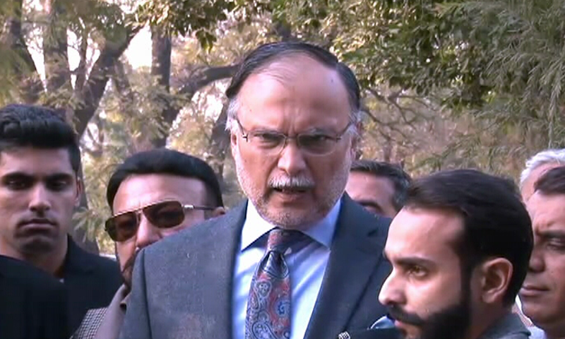 PML-N stalwart Ahsan Iqbal talks to reporters before appearing before NAB. — DawnNews TV