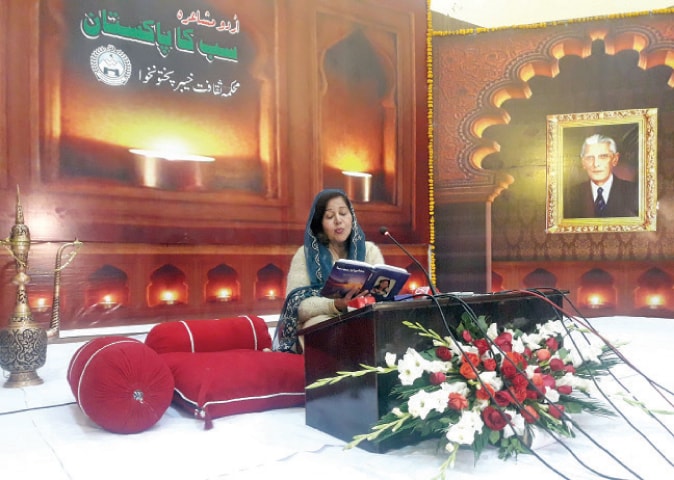 AN Urdu poet recites her verses at a mushaira held in Peshawar on Wednesday to mark Christmas and birth anniversary of Quaid-i-Azam Mohammad Ali Jinnah. &mdash; Dawn