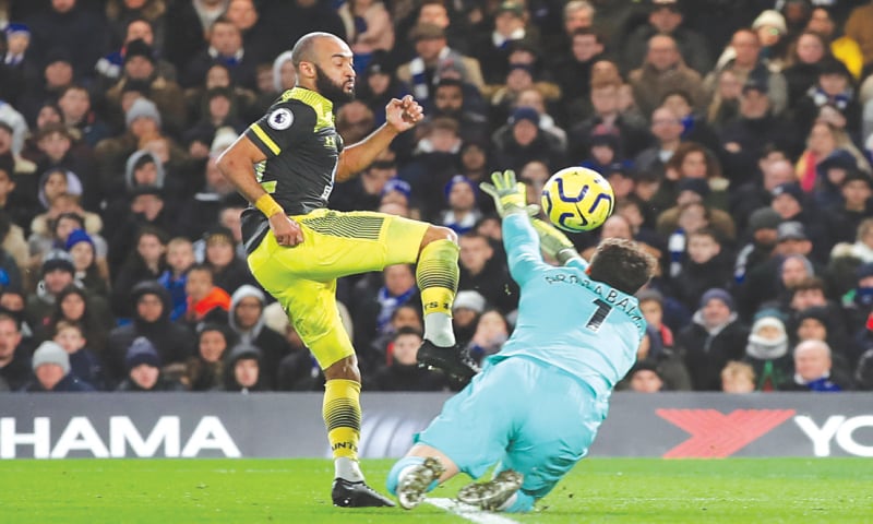 LONDON: Southampton’s Nathan Redmond scores past Chelsea goalkeeper Kepa Arrizabalaga during their Premier League match at Stamford Bridge on Thursday.—Reuters