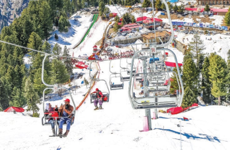 Tourists enjoy chairlift ride over the snow-covered slopes of Malam Jabba Ski Resort, Swat. — Photo by Fazle Khaliq