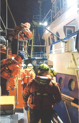 Rescuers of French volunteer organisation, SNSM, taking part in a rescue operation of a group of migrants attempting to cross the English Channel.&mdash;AFP
