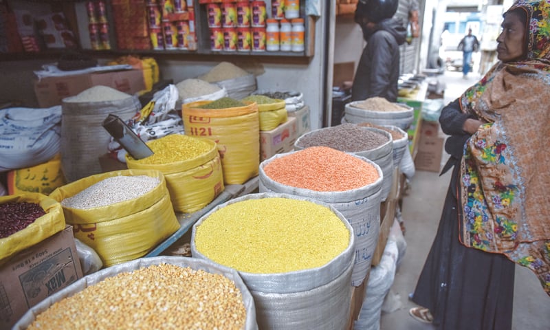 CONSIDERING the high prices mentioned by the shopkeeper, a woman in a quandary over what to buy at a shop in the Shahabuddin Market on Thursday.—White Star