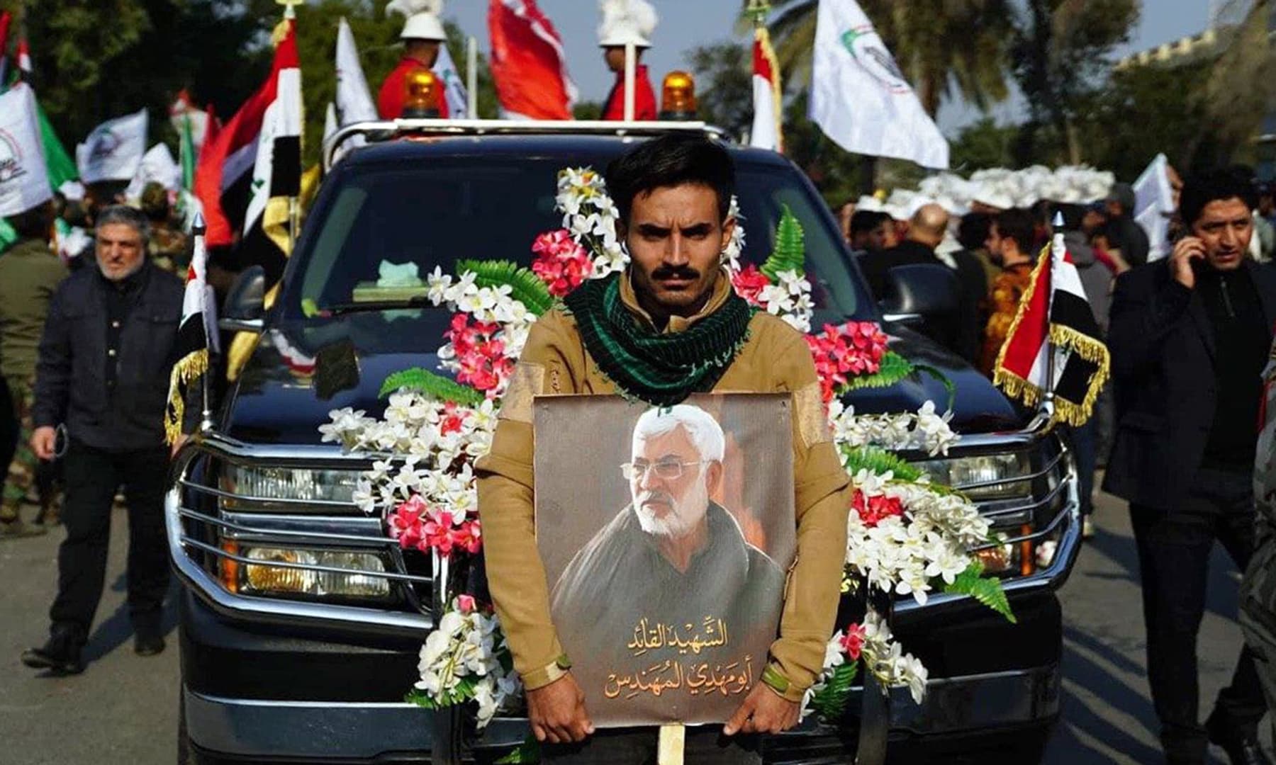 A handout picture released by Iraq's Hashed al-Shaabi paramilitary force shows a scene from the funeral procession for slain Iranian military commander Qasem Soleimani and Iraqi paramilitary chief Abu Mahdi al-Muhandis just outside Baghdad's high-security Green Zone on January 4. — AFP