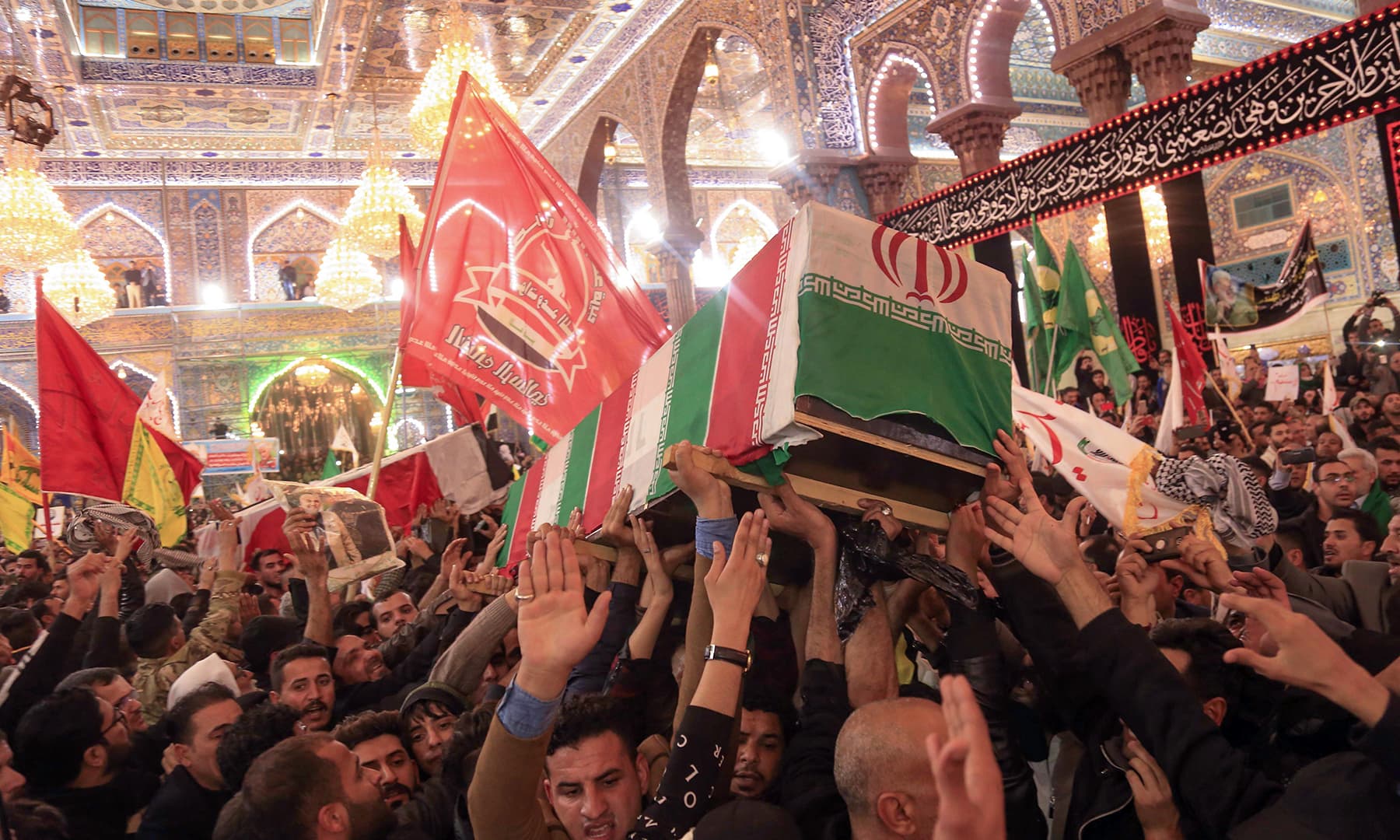 Mourners carry the coffins of slain Iraqi paramilitary chief Abu Mahdi al-Muhandis, Iranian military commander Qasem Soleimani and eight others inside the Shrine of Imam Husain in the holy Iraqi city of Karbala. — AFP