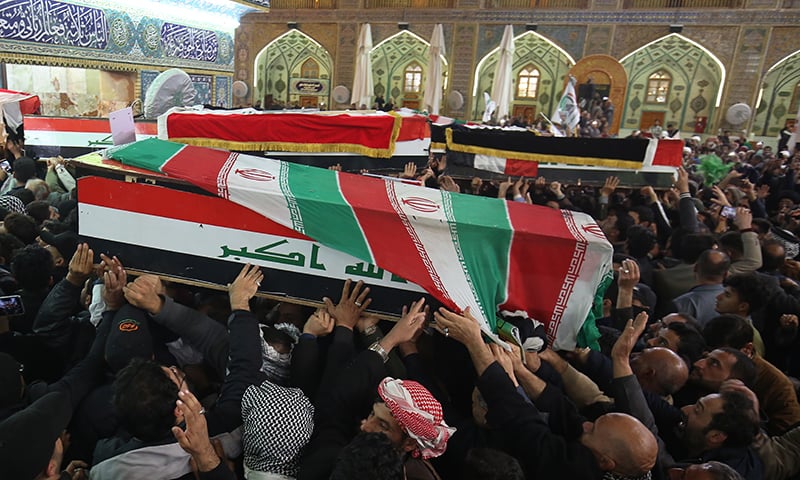 Mourners carry the coffins of Iran's Gen. Qassem Soleimani and Abu Mahdi al-Muhandis, deputy commander of Iran-backed militias at the Imam Ali shrine in Najaf, Iraq on  Saturday. — AP